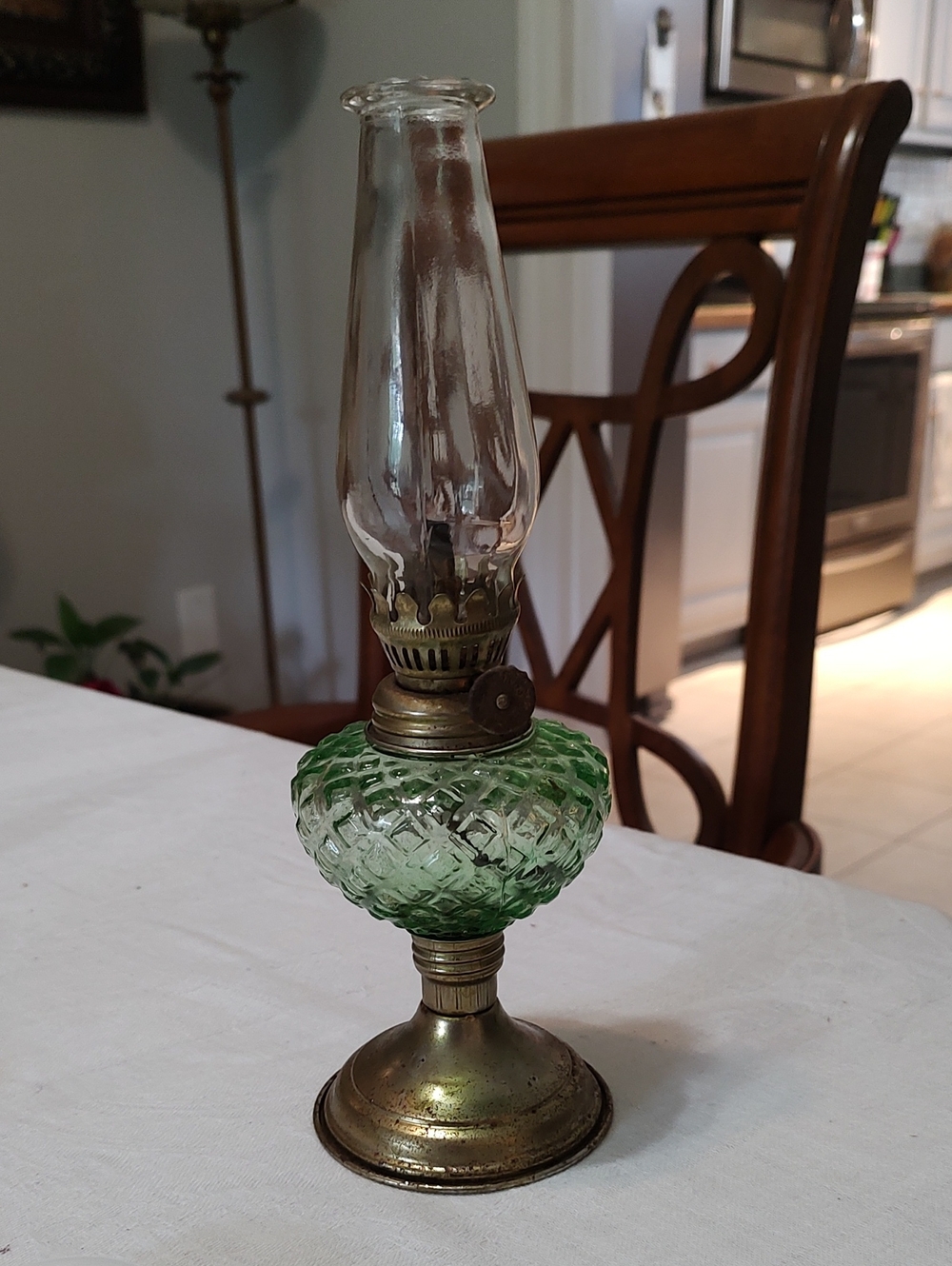 Vintage Small Oil Lamp With Clear Globe And Green Center With Brass Bass.